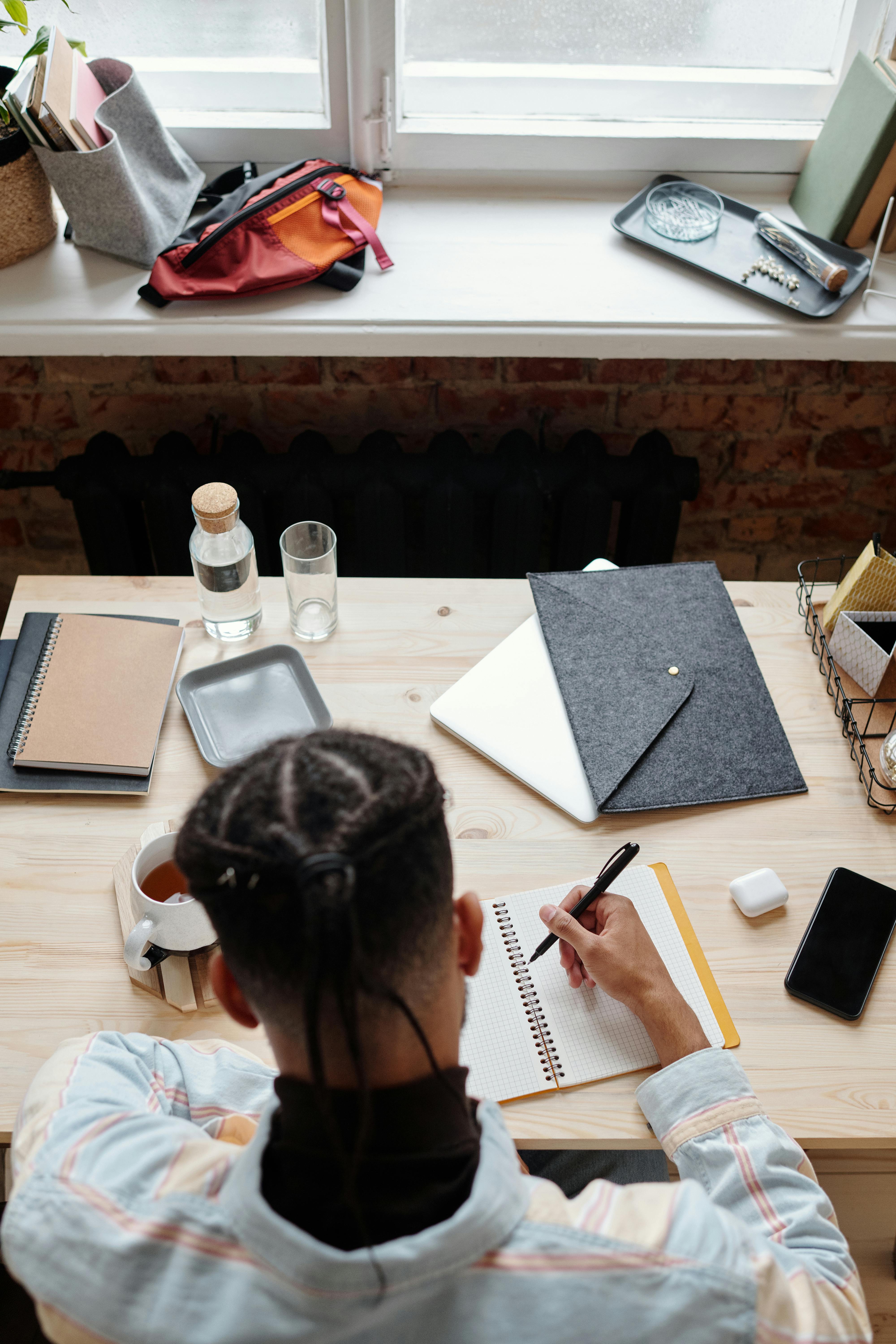 student studying on a wooden table