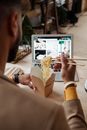 Person Holding Brown Paper Bag With White Ipad