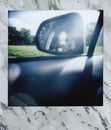 Car Side Mirror Showing Car