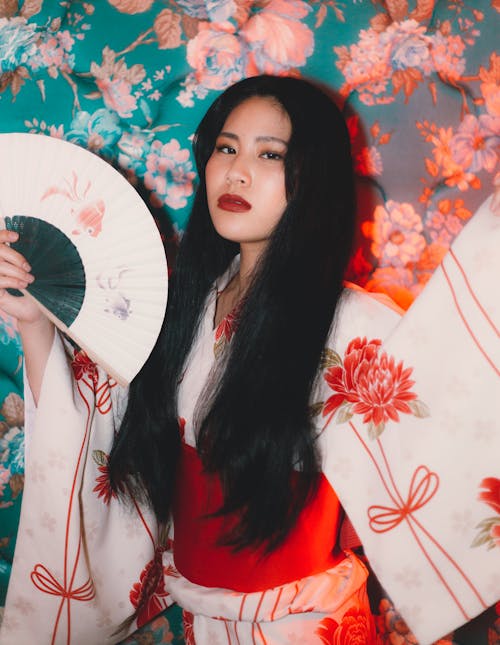 Brunette in Kimono Holding Fan