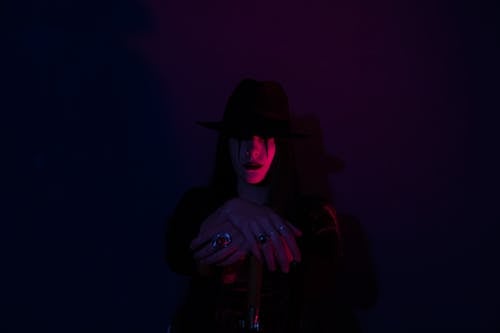 Free Scary Person in the Dark Wearing a Black Hat  Stock Photo