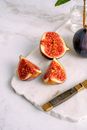 Sliced Red Fruit on White Textile