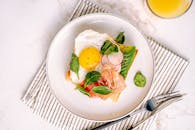 Egg With Green Leaf Vegetable on White Ceramic Plate