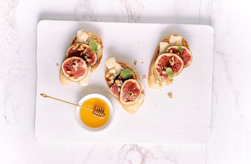 Breads with Toppings on a White Tray
