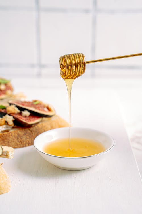 White Ceramic Bowl With Syrup dipper