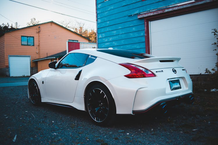 Contemporary Car Placed Near Garage In House