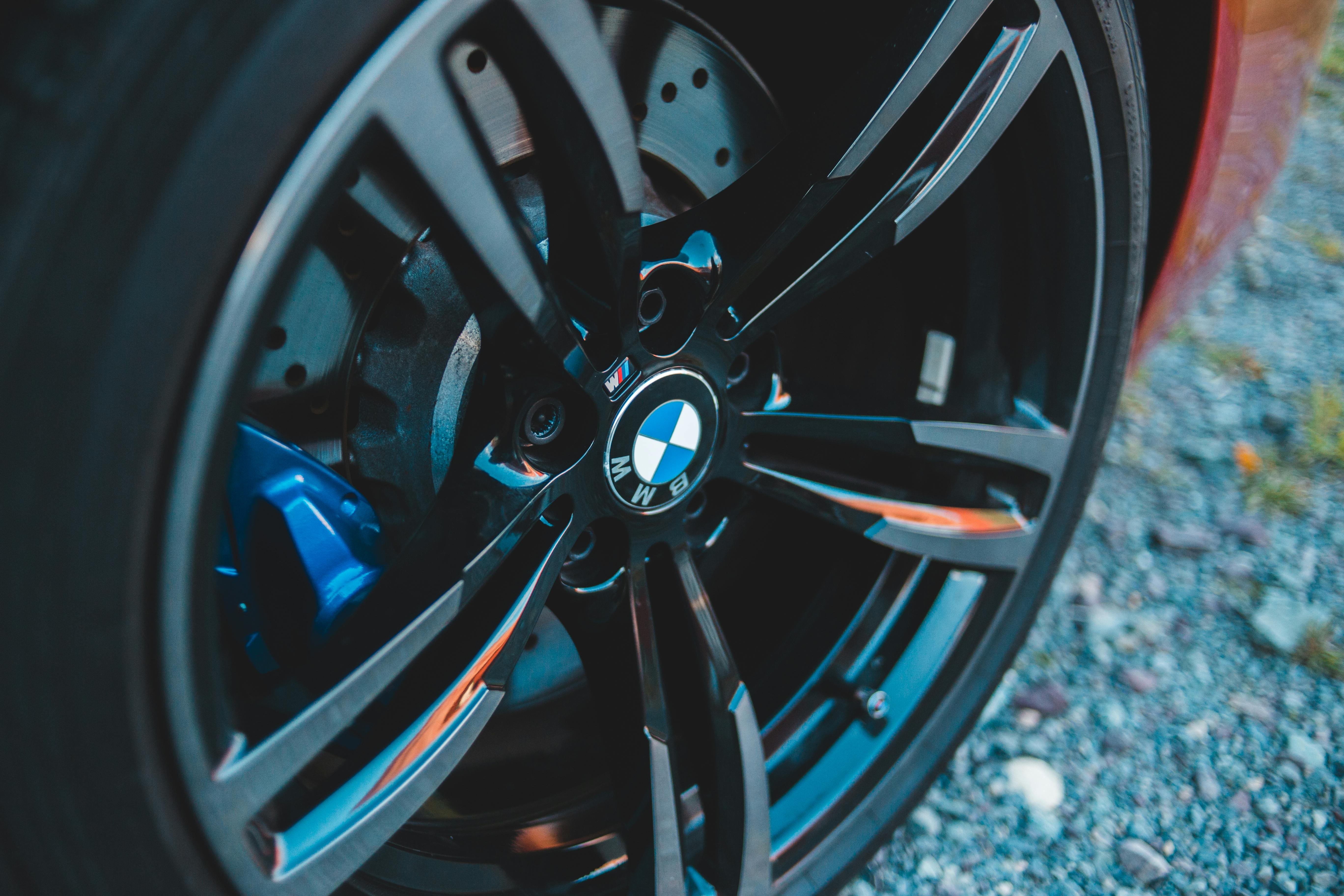 Closeup of black wheel with emblem of contemporary car