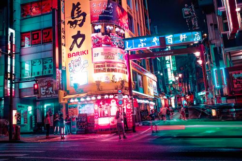 Free Explore the vivid neon lights and bustling nightlife of Shibuya, Tokyo, capturing urban life and architecture. Stock Photo