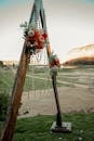 Brown Wooden Swing on Green Grass Field