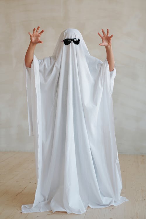 Person Wearing White Halloween Costume and Sunglasses