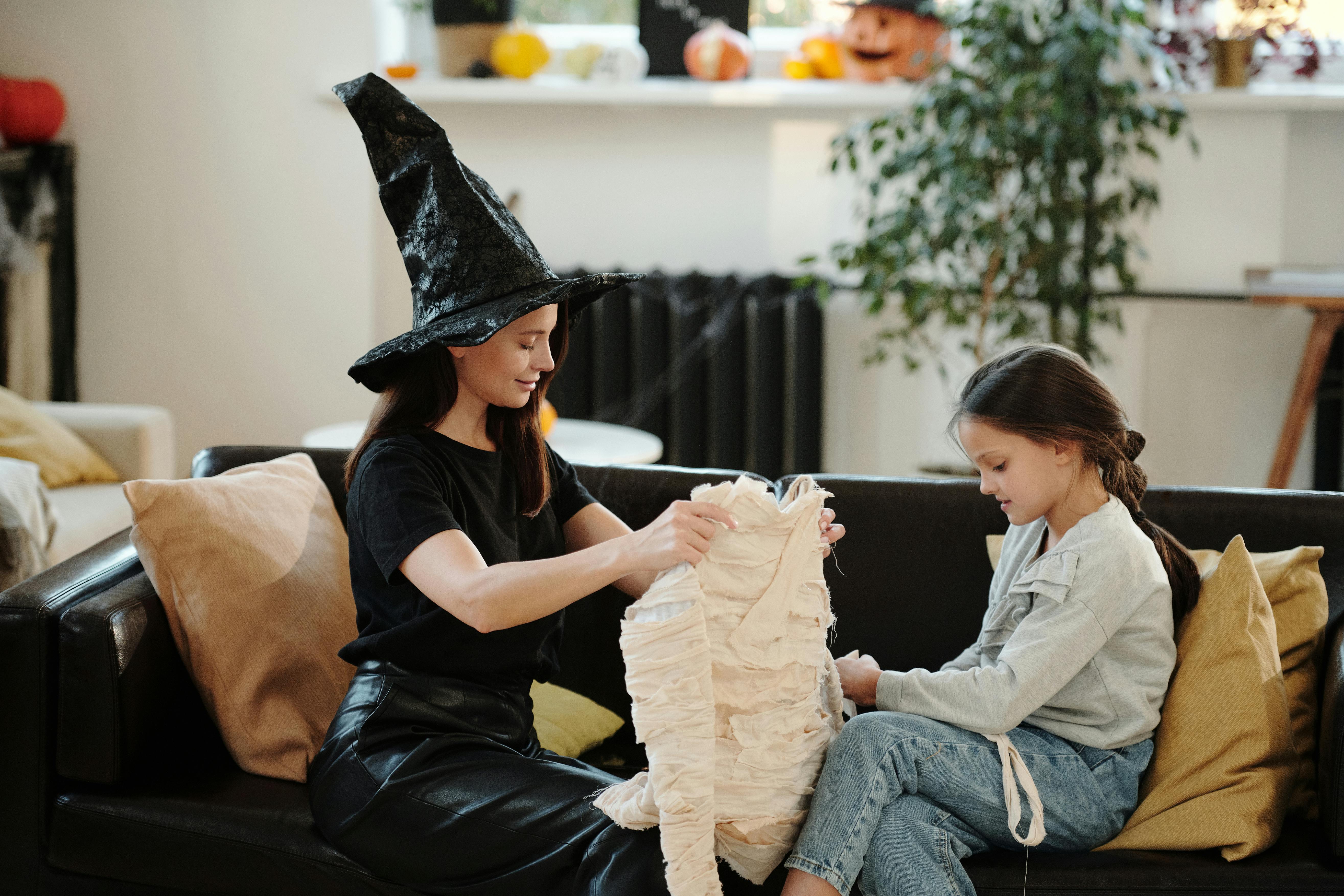 mother holding a mummy costume