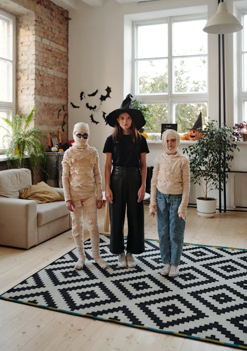 A Family Wearing Halloween Costumes