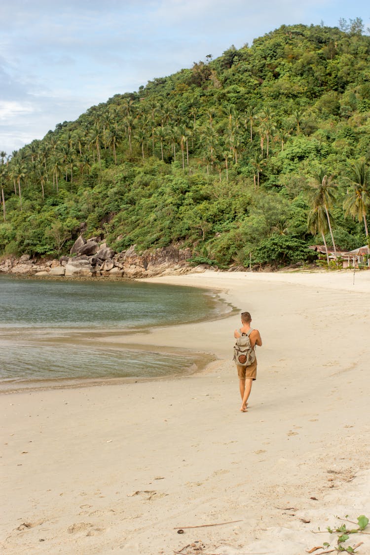 Man Walking On A Tropical Beach 