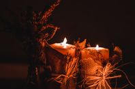 White Candle Holder With Lighted Candles
