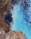 Brown Rocky Shore With Water