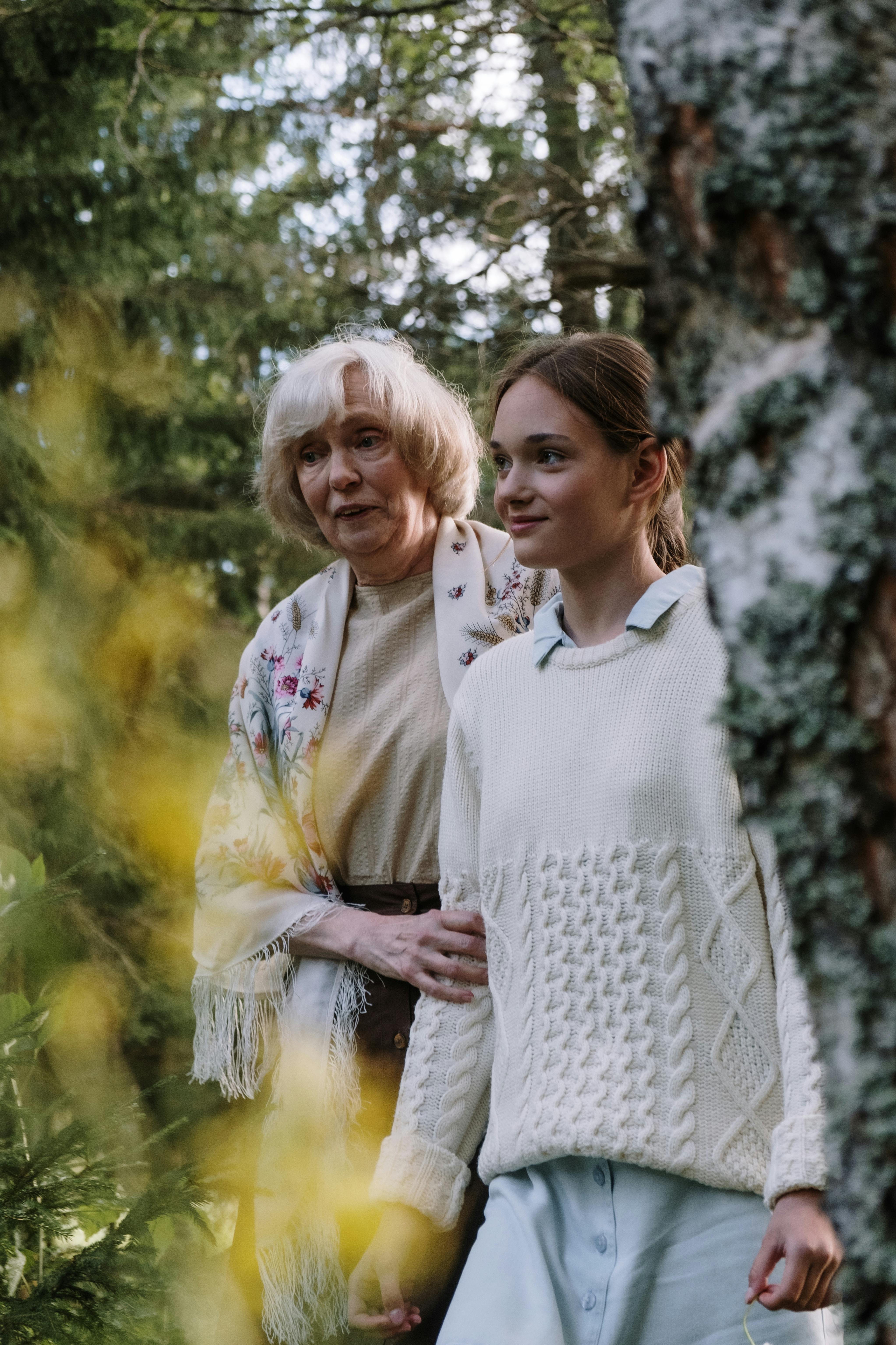 a grandmother walking with her granddaughter