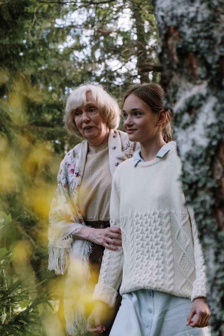 A Grandmother Walking With Her Granddaughter