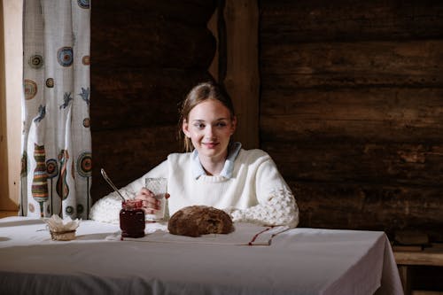 A Woman Holding a Glass of Milk