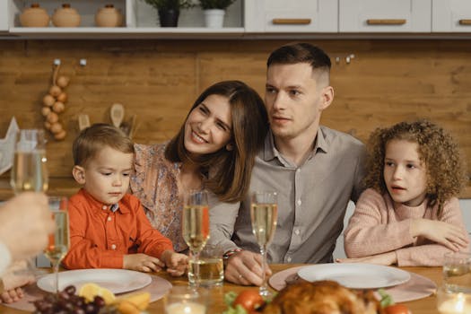 A joyful family gathers for a festive dinner, exchanging warmth and togetherness.