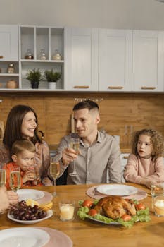 A cheerful family gathering for a Thanksgiving dinner indoors.