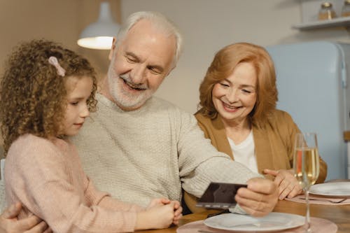 Free A Family Sitting at the Table Stock Photo