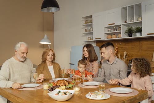 A Family Having Dinner at the Table