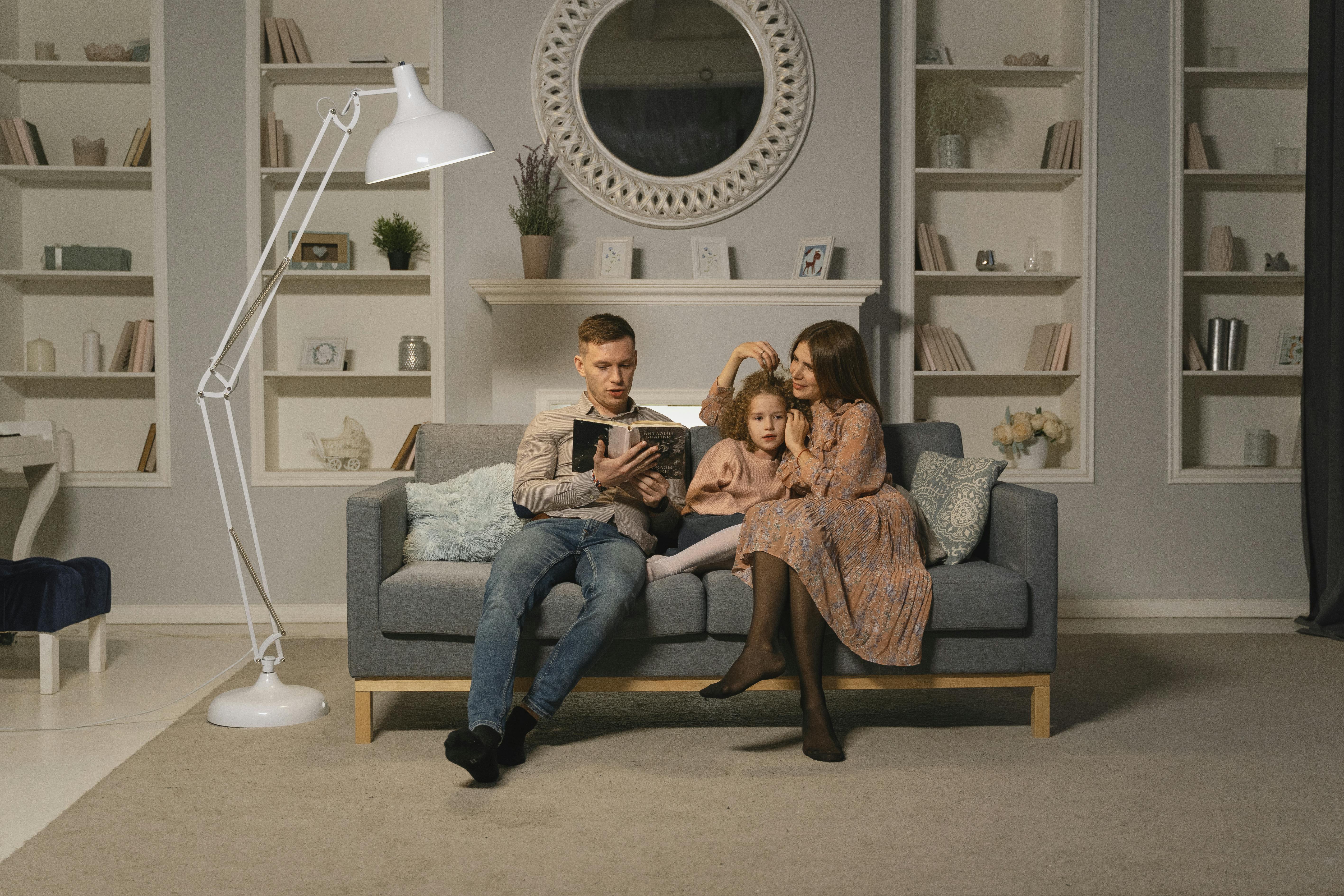 a family sitting on the couch