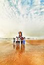 3 Women Standing on Beach
