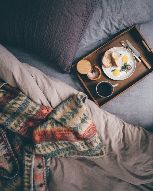 Free Tray with fresh breakfast on bed Stock Photo
