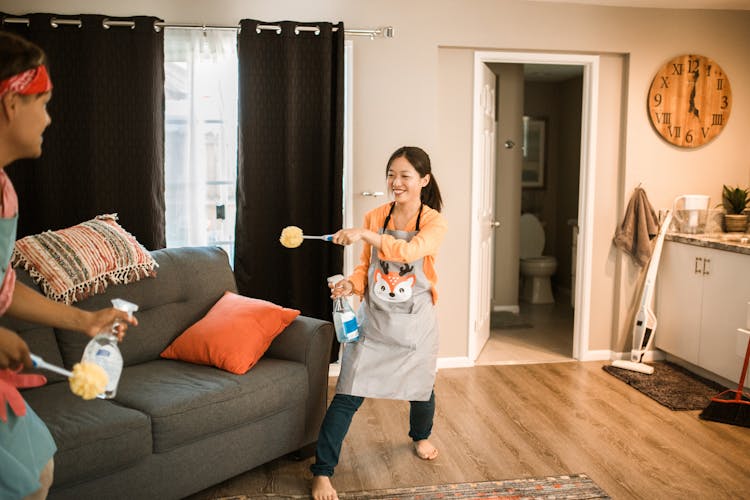 A Couple Playing While Doing House Chores