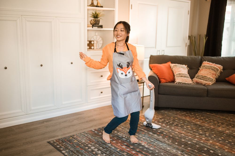 Vacuuming a bright living room