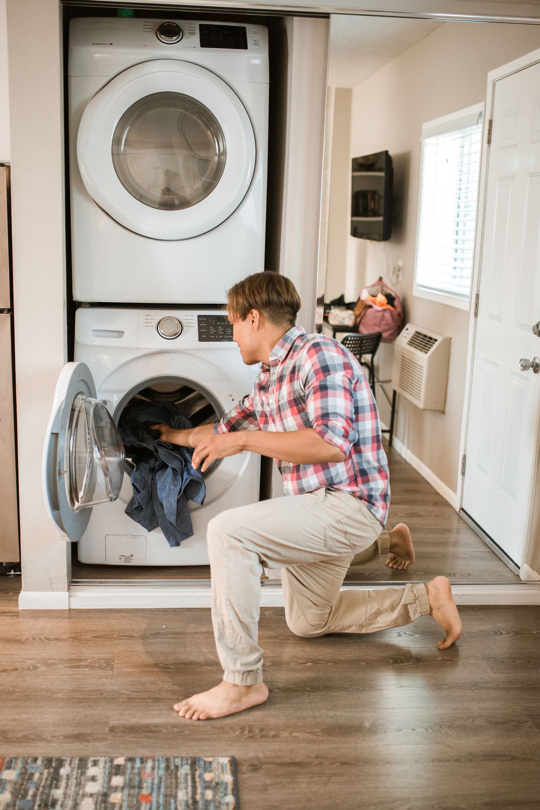 Front load washing machine laundry scene for Zanussi appliance repair Dubai