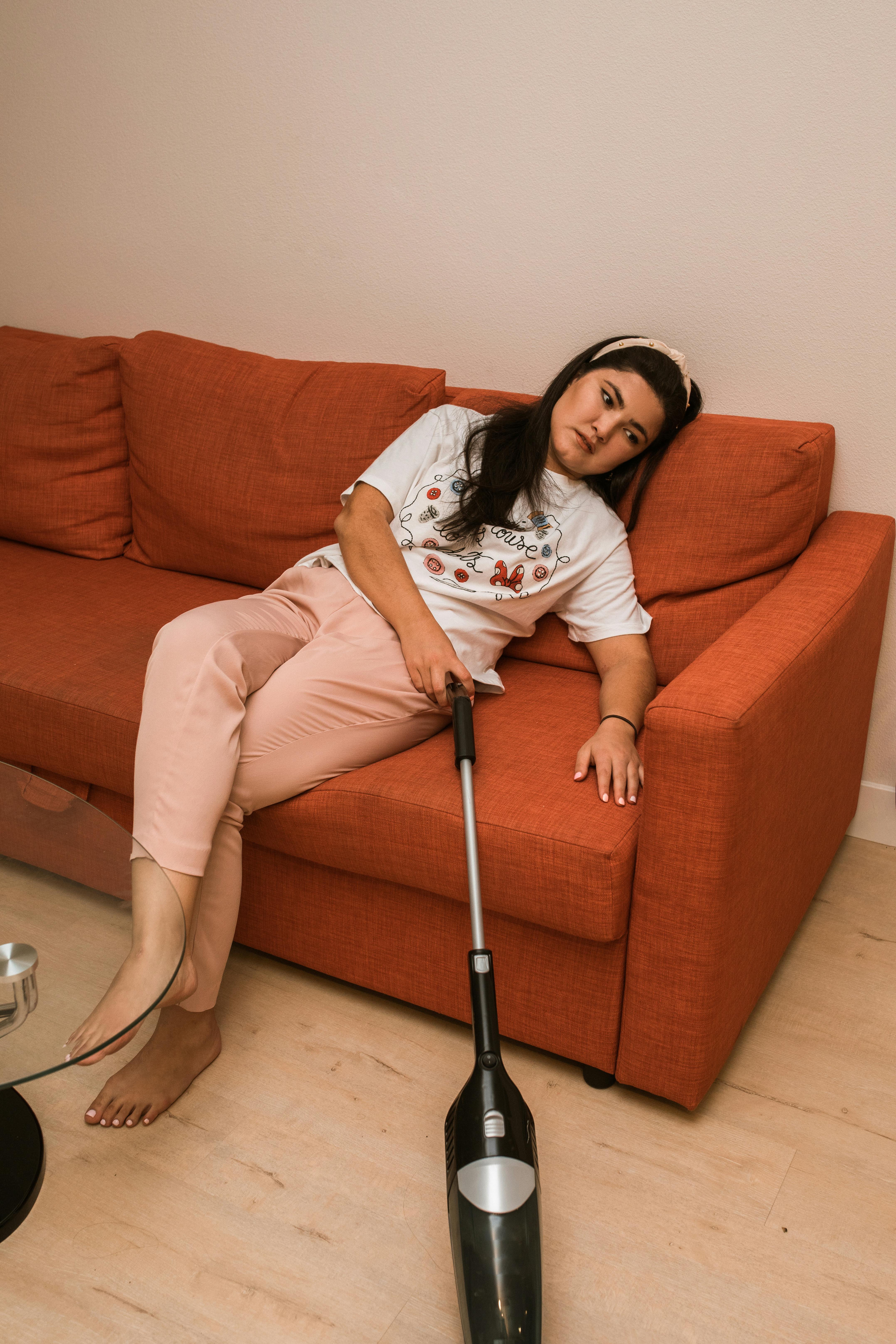 Woman Cleaning Sofa With Vacuum Cleaner Stock Photo - Download Image Now -  Cleaning, Sofa, Dirty - iStock