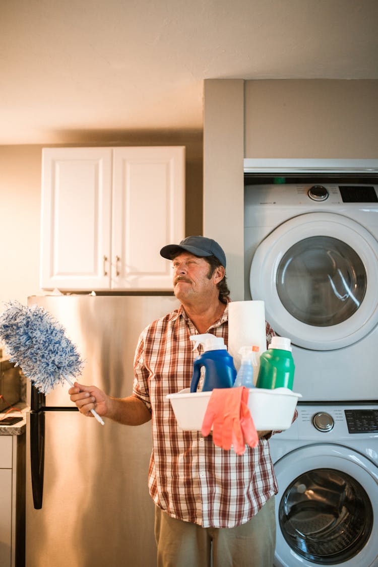 A Person Holding Cleaning Detergents