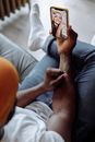 Person in Blue Denim Jeans Holding Smartphone