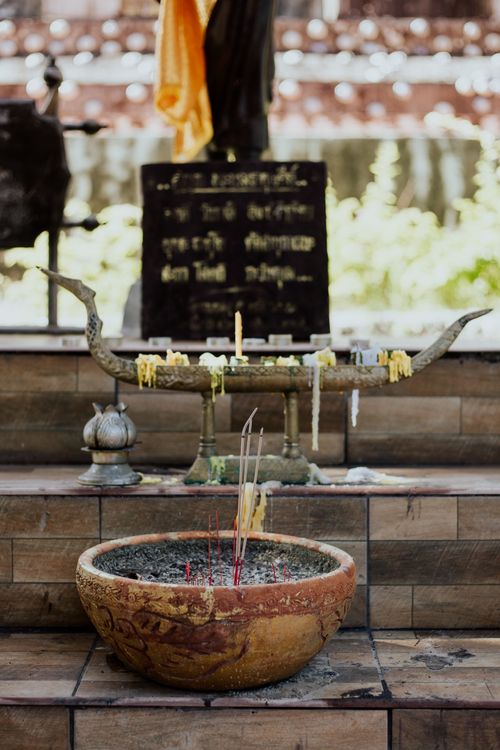 Free Close-up of incense bowl and candles at a Buddhist temple altar. Stock Photo