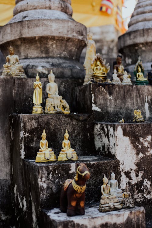 Close-Up Shot of Statuette on Concrete Blocks