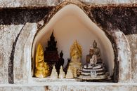 Gold Buddha Figurine on White Ceramic Heart Shape Tray