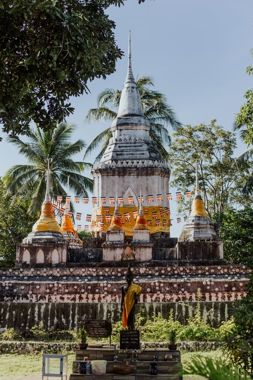 Free Buddhist stupa nestled in lush Thailand greenery, showcasing religious architecture. Stock Photo