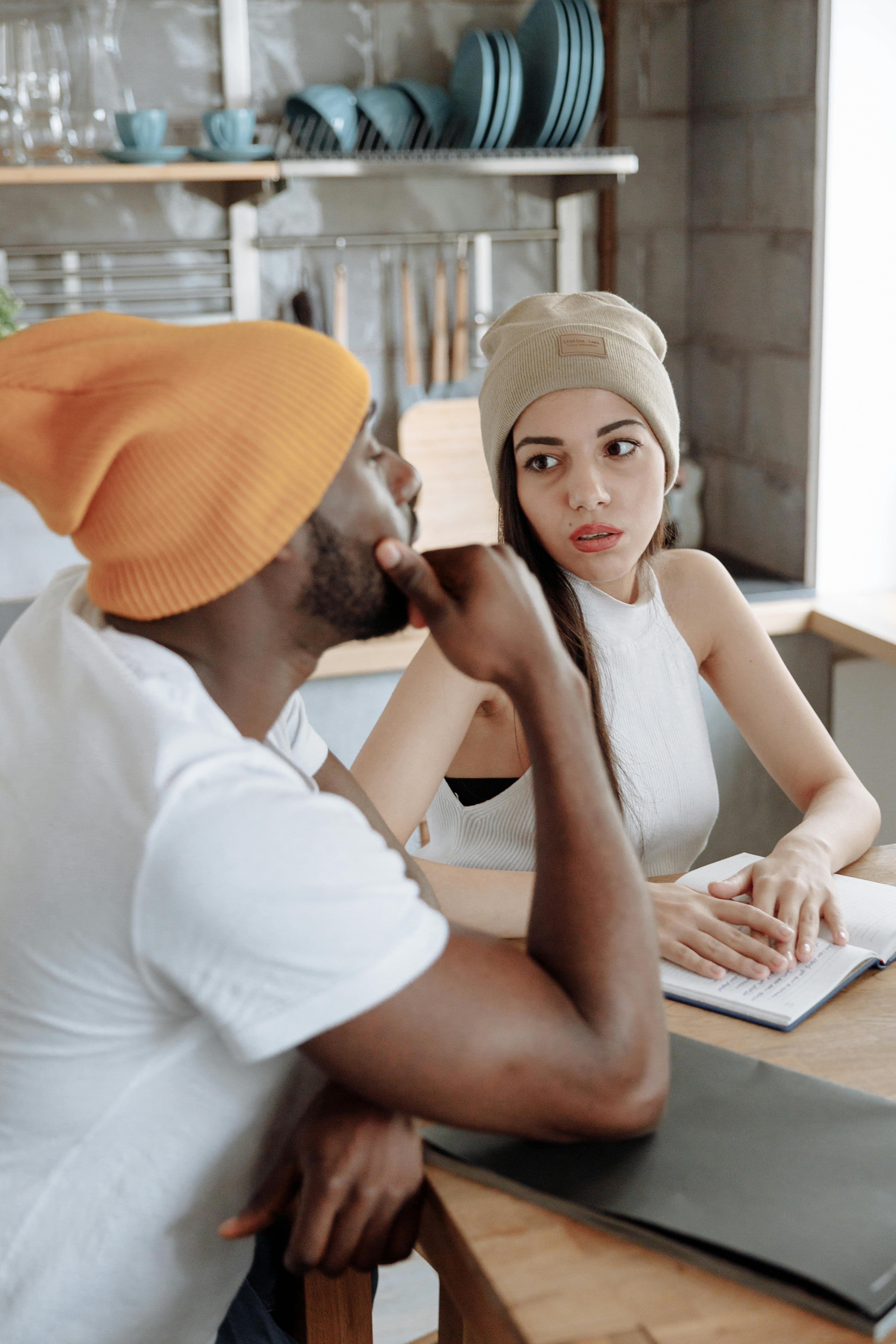 man and woman sitting on chair