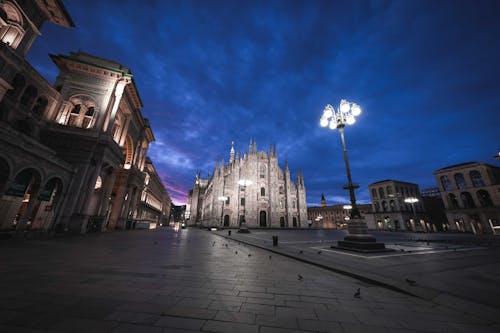 Classic buildings on square at night