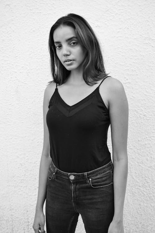 Free Grayscale Photo of a Young Woman in a Black Top Stock Photo