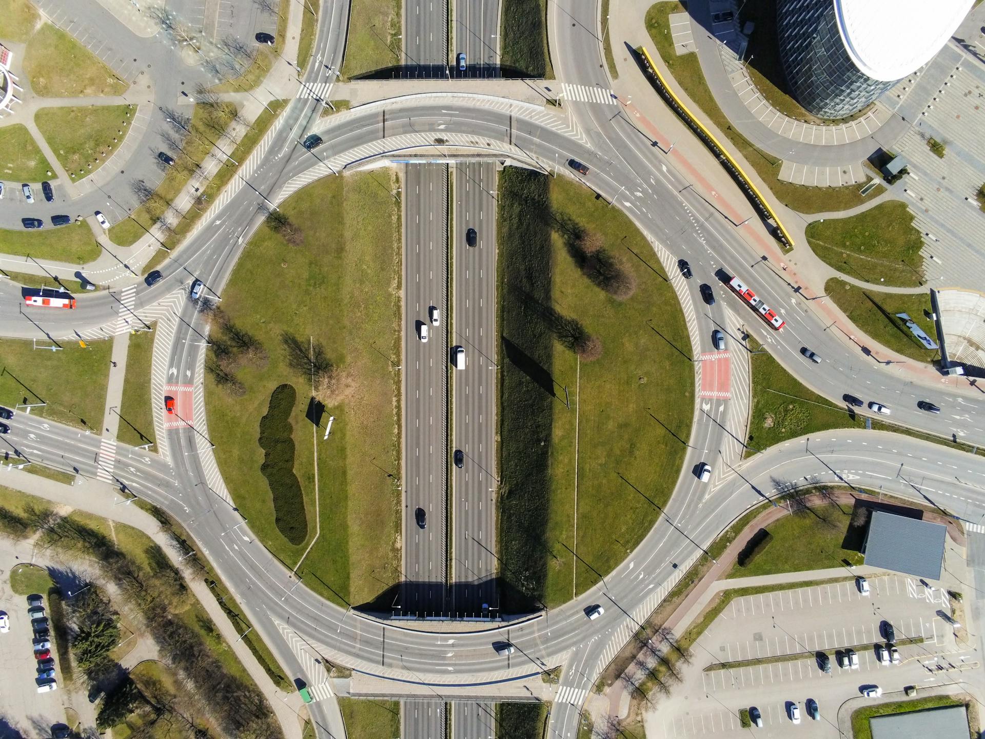 Aerial shot of a busy roundabout and highway intersection in Vilnius, Lithuania.