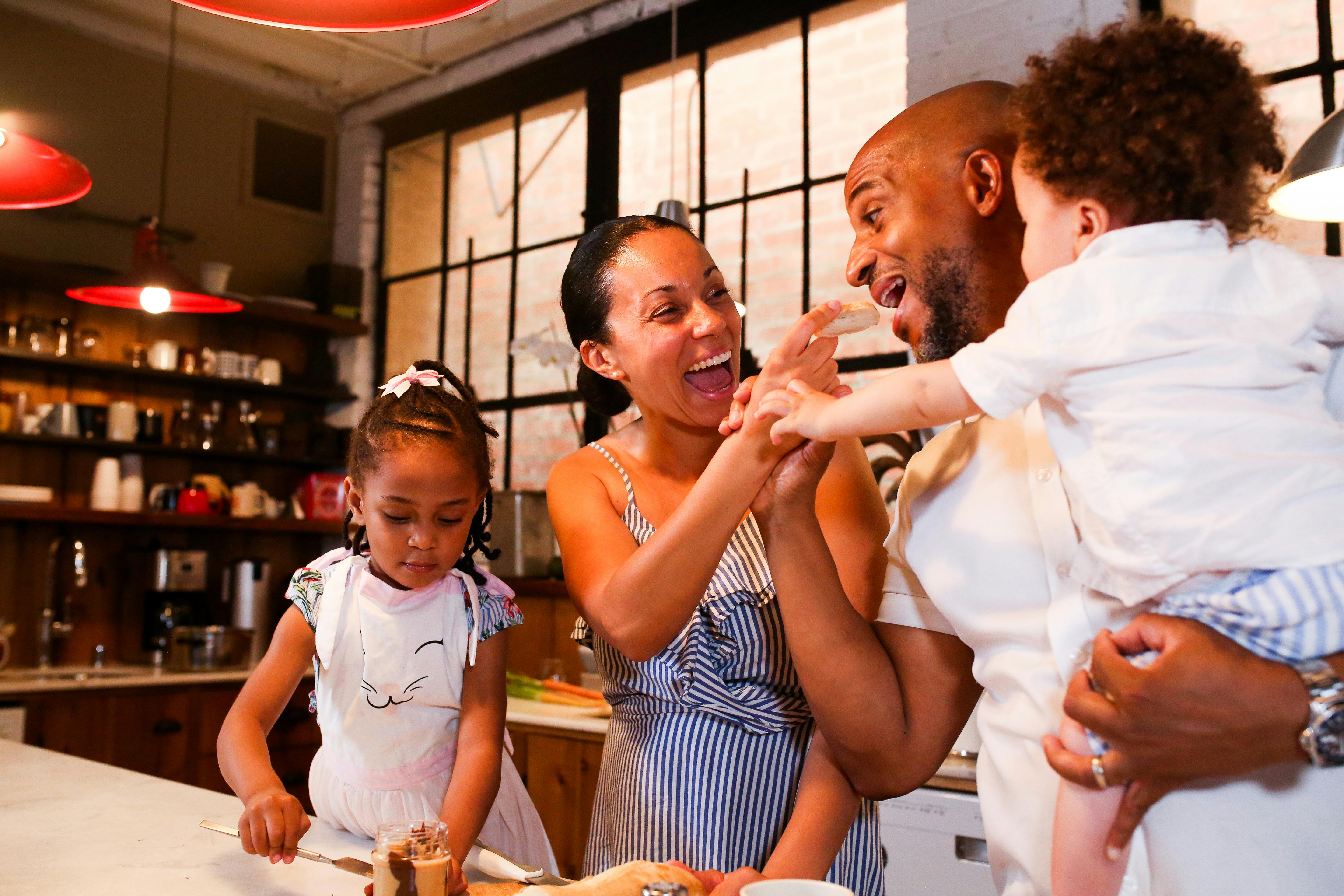 a happy family in a kitchen