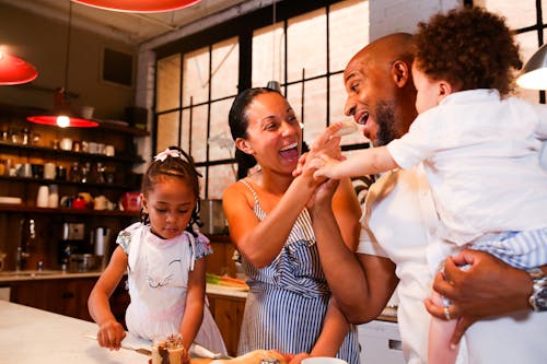 Free A Happy Family in a Kitchen Stock Photo