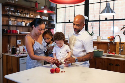 Free A Family Together in a Kitchen Stock Photo