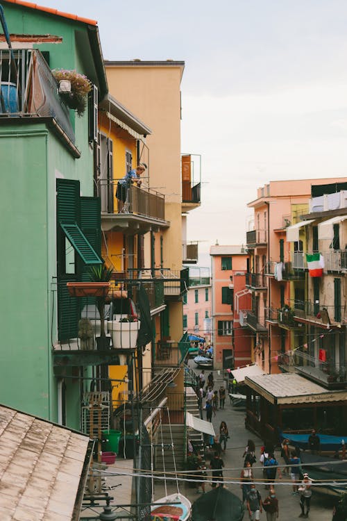 From above of old residential houses with balconies located on narrow street in European city