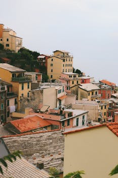 Picturesque view of a colorful Mediterranean village with hillside houses.