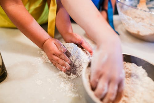 Free A Child Baking on a Kitchen Counter Stock Photo