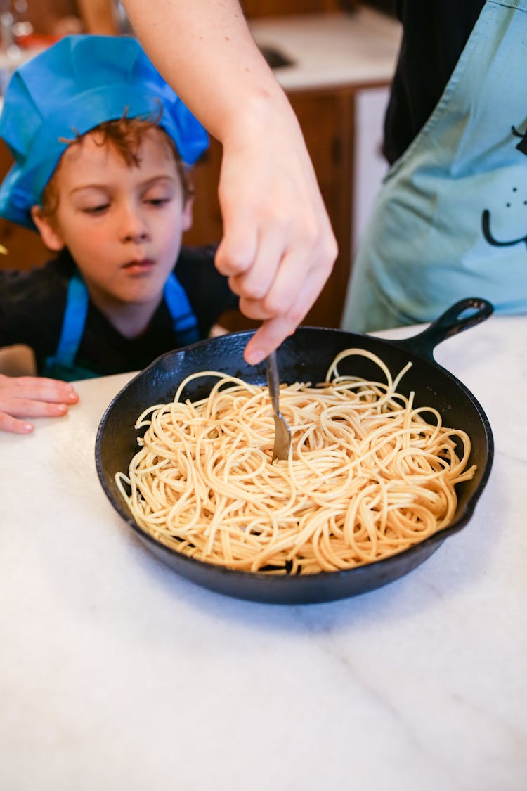 A Person Cooking Pasta